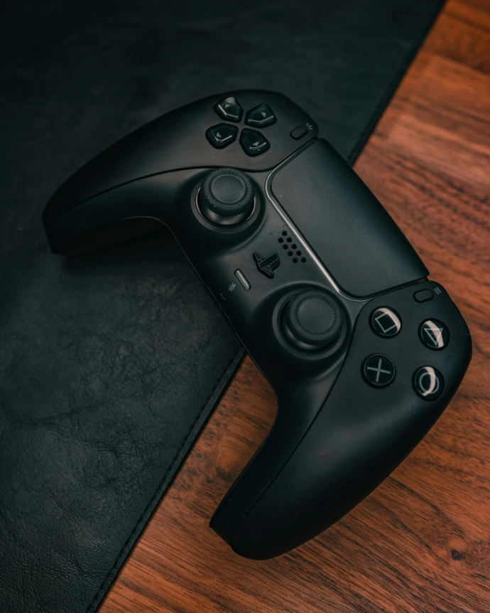 a close up of a video game controller on a table